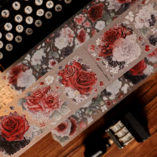 Handheld macro of Scarlet Floral Glitter Sand PET die-cut tape with vivid scarlet tones and sparkling grain in natural light