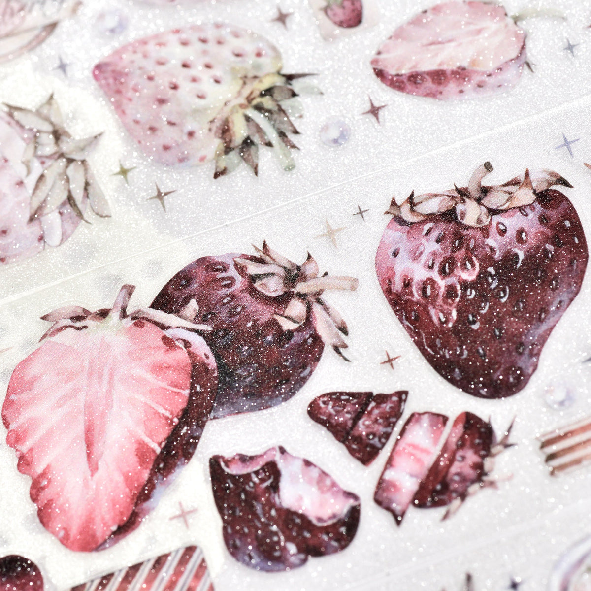 Close-up of Antique Strawberry die-cut PET tape with vintage red tones and matte shimmer on white background
