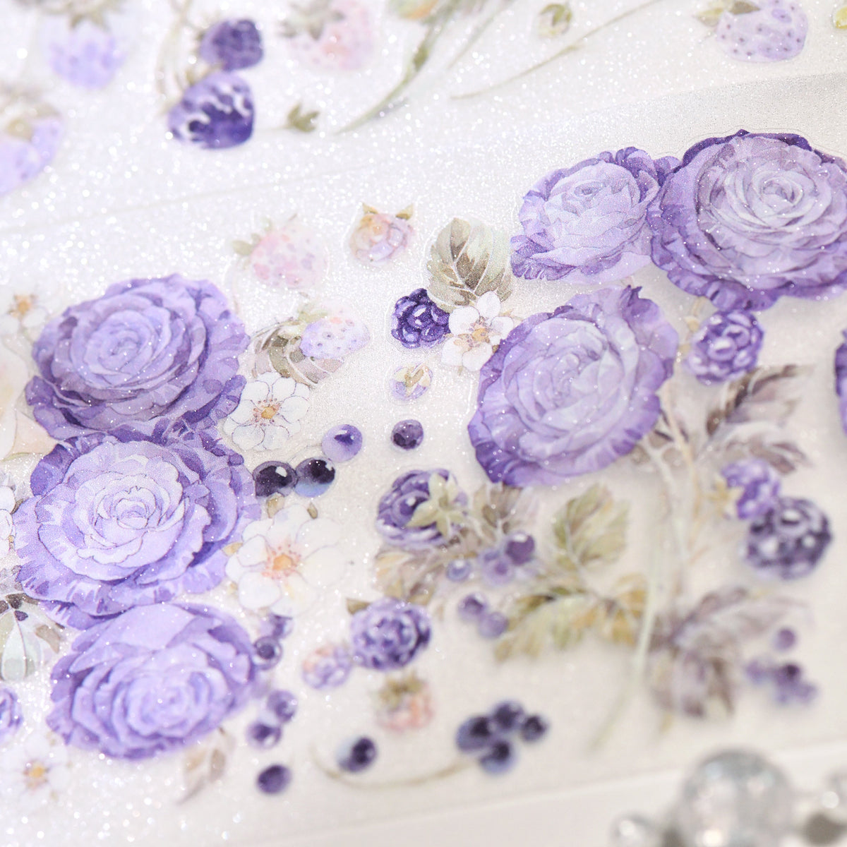 Close-up detail of Bramble Periwinkle Blue Glitter Sand PET die-cut tape highlighting periwinkle blue floral edges and sandy sparkle finish