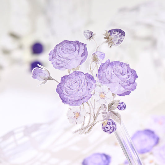 Handheld close-up of Bramble Periwinkle Blue Glitter Sand PET die-cut tape with sparkling grain and blue flower motifs styled with journal elements