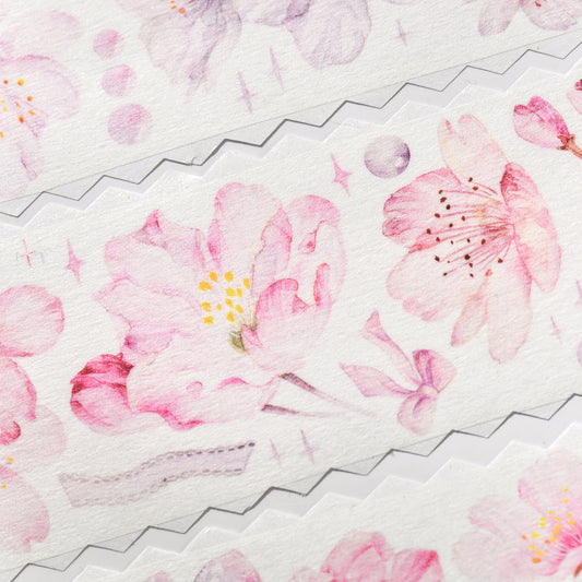 Close-up detail of Cherry Blossom Glitter Sand PET die-cut tape highlighting blush pink floral edges and sandy sparkle finish