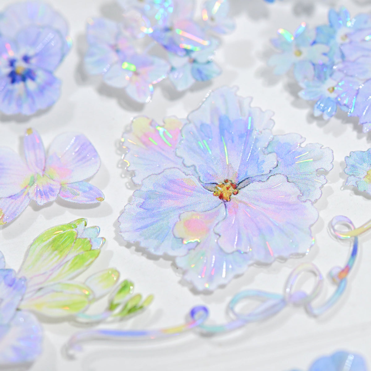 Close-up detail of Kaleidoscope Shimmering Blue Glitter Sand PET die-cut tape highlighting blue floral edges and sandy sparkle finish