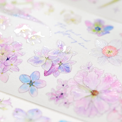 Macro close-up of Kaleidoscope Shimmering Pink Glitter Sand PET die-cut tape with textured glitter grain and layered pink blossom petals