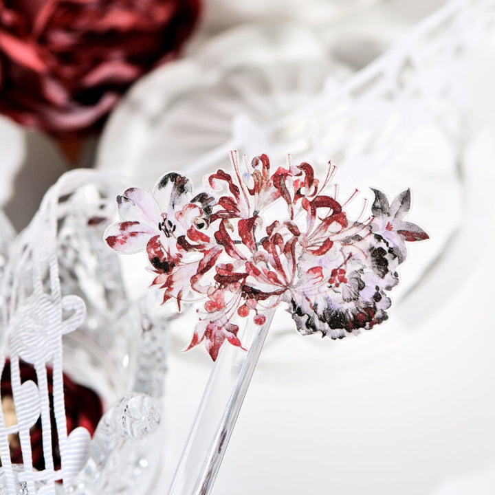 Handheld macro of Red Spider Lily Glitter Sand PET tape with vivid red floral design sparkling texture and journal elements styled in the background
