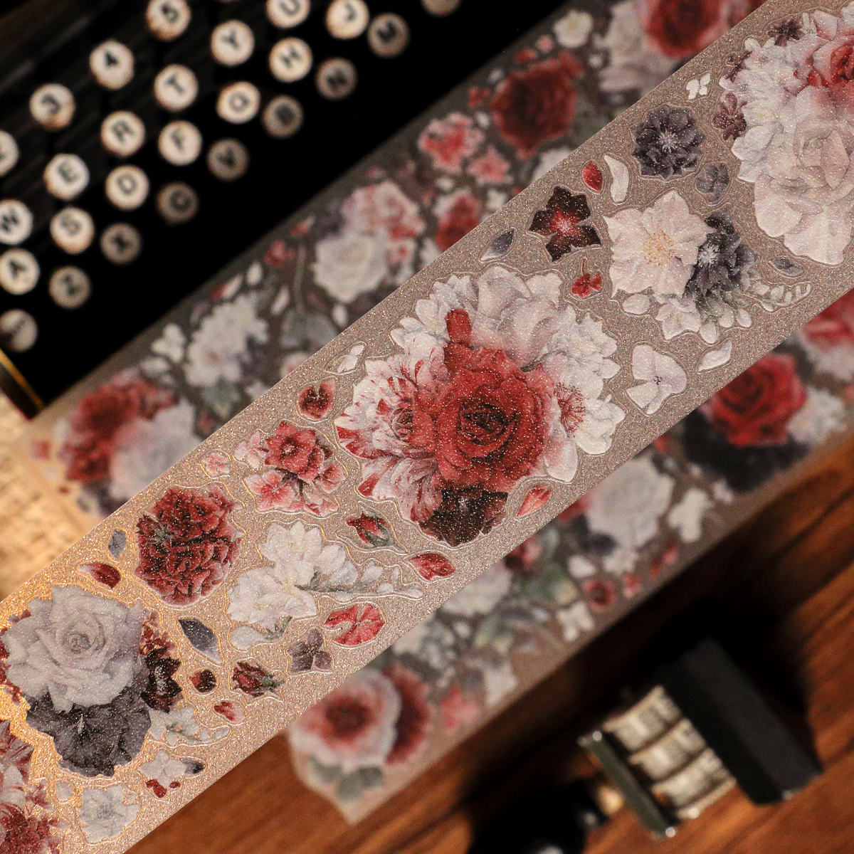 Close-up of Scarlet Floral Glitter Sand PET tape die-cut edges with glitter texture and layered flower silhouette