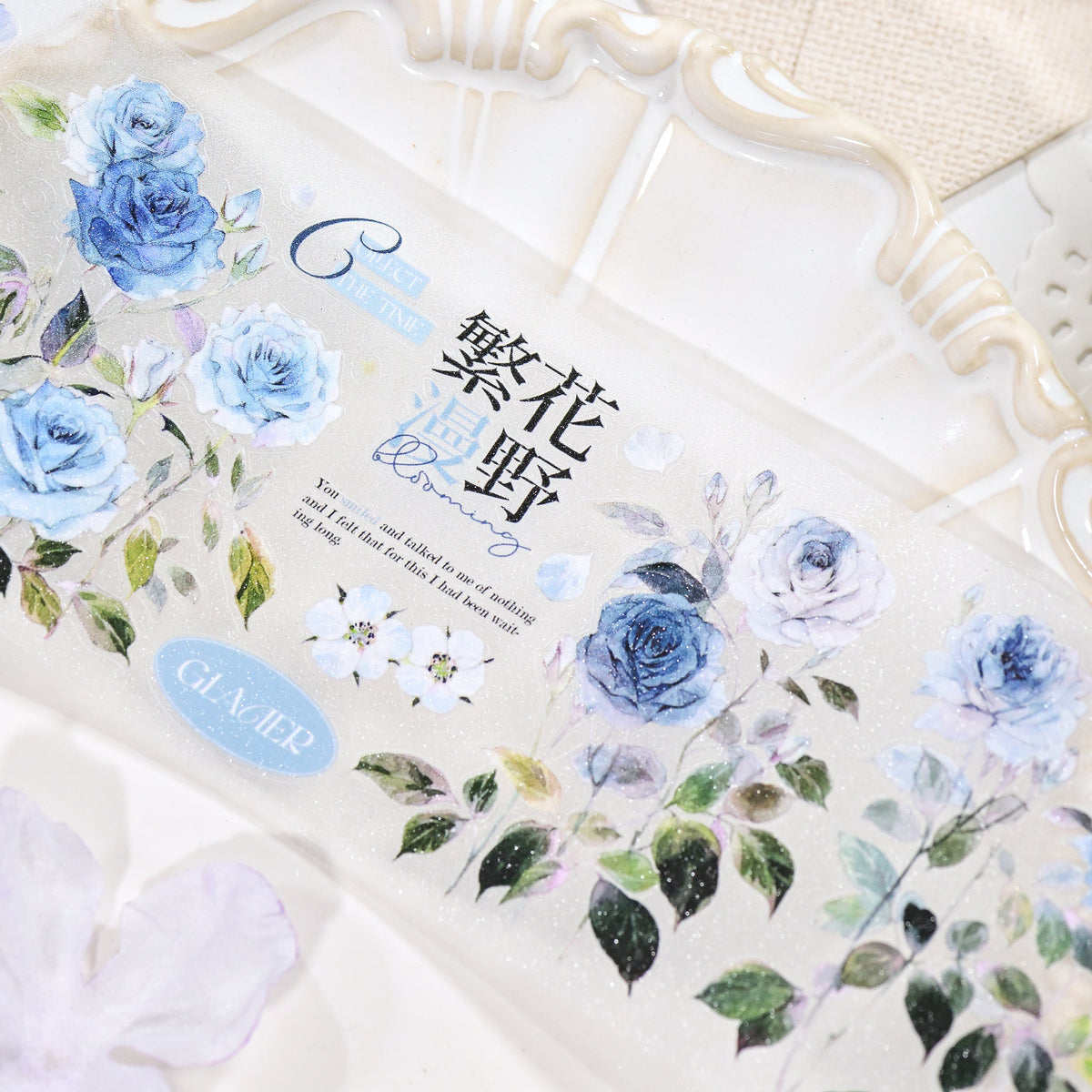 Close-up detail of Wilderness Rose Glacial Blue Glitter Sand PET die-cut tape highlighting blue rose edges and sandy sparkle finish
