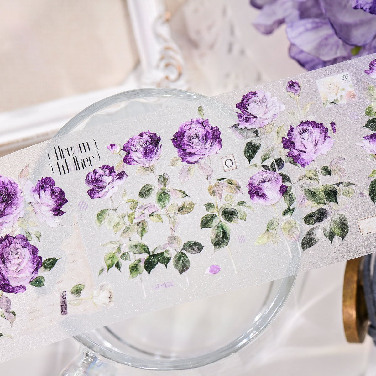 Macro close-up of Wilderness Rose Glacial Purple Glitter Sand PET die-cut tape with textured glitter grain and layered purple rose petals