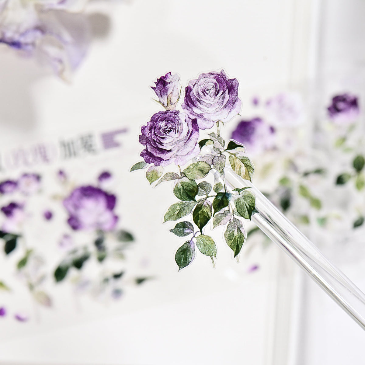 Close-up detail of Wilderness Rose Glacial Purple Glitter Sand PET die-cut tape highlighting purple rose edges and sandy sparkle finish
