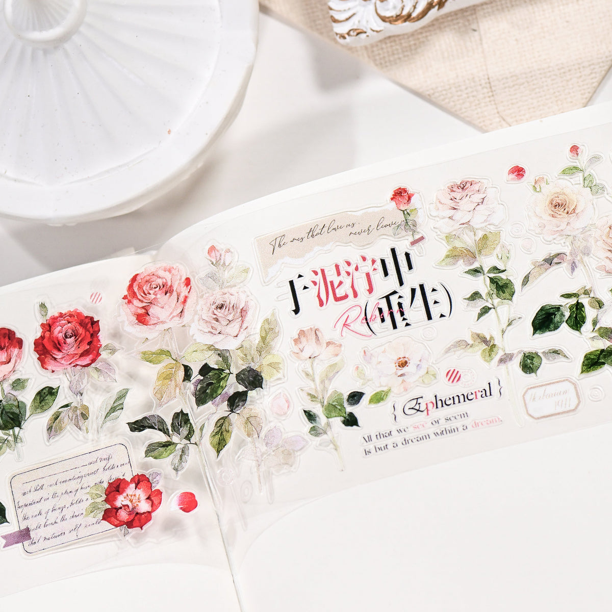 Close-up detail of Wilderness Rose Glacial Red Glossy PET die-cut tape with smooth glossy sheen and rich red floral silhouette in a styled composition